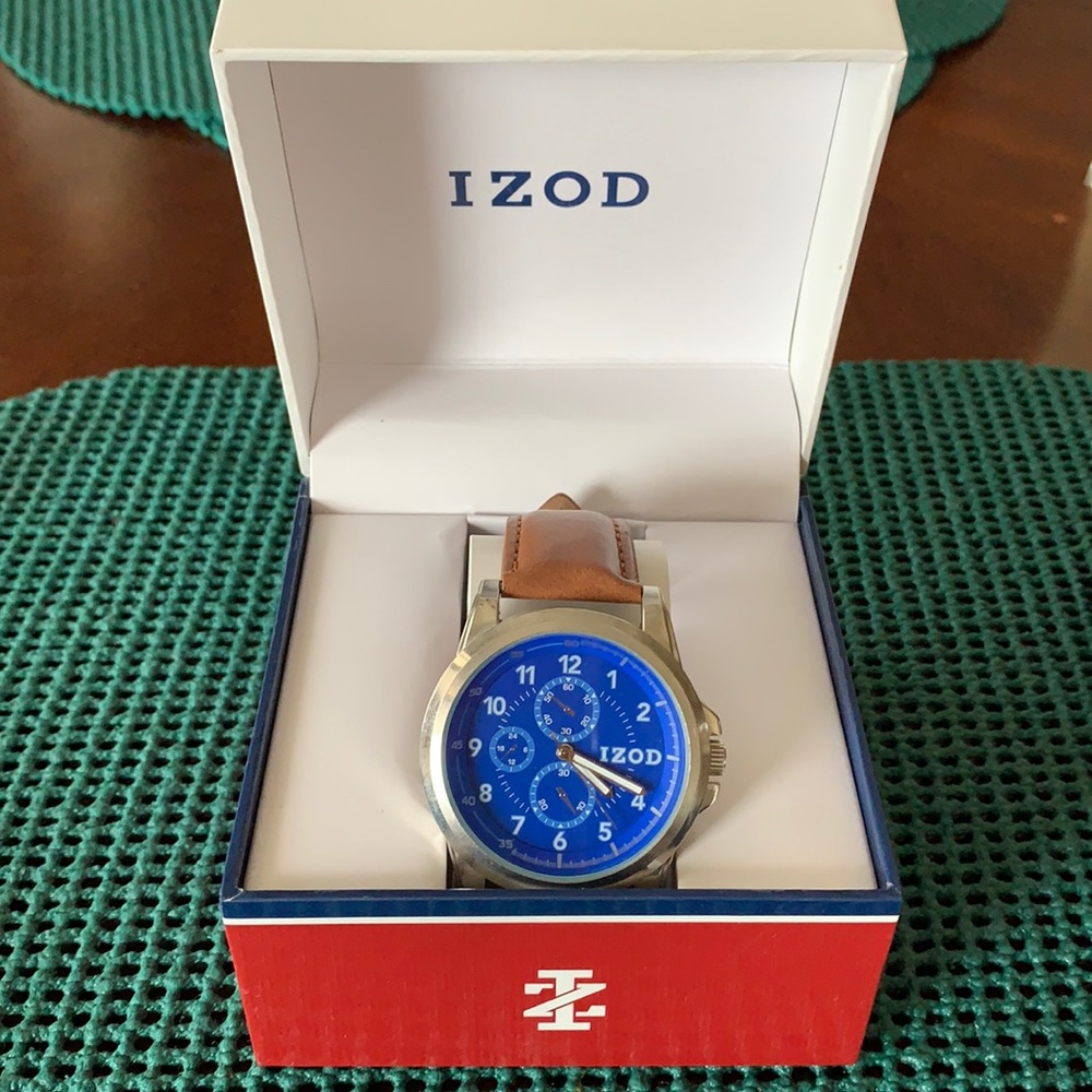 Watch Izod. New in box. Never worn. Light brown leather band. Blue face.